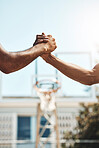 Basketball men handshake before game at sport court for good luck, agreement and support. Sports, fitness and athletes shaking hands to show unity, thank you and agreement for success during match