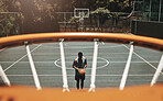 Above, net and basketball man with aim in training, practice or exercise for healthy sports on court. Black man, basketball player and basketball court for shooting in workout, fitness and health