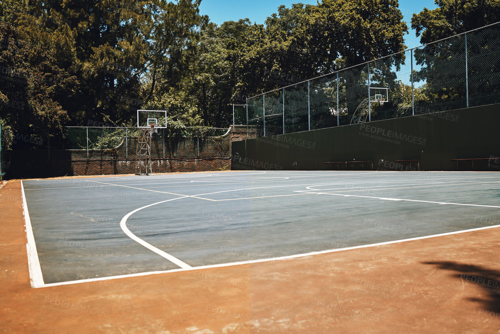 Buy stock photo Sports, basketball court and nature, outdoor park and  space for youth to exercise, workout and play in summer. Basketball, fitness and health, playground with trees and motivation for playing game.