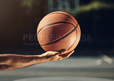 Buy stock photo Sport, hand and basketball training at basketball court with man holding ball before practice. Fitness, health and sports guy getting ready for cardio, endurance and energy exercise alone outdoors