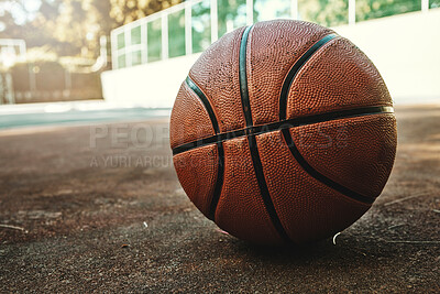 Buy stock photo Basketball sport ball in empty basketball court to play, train and practice for tournament game and training. Summer sports exercise and fitness workout training area, nobody or outdoor competition