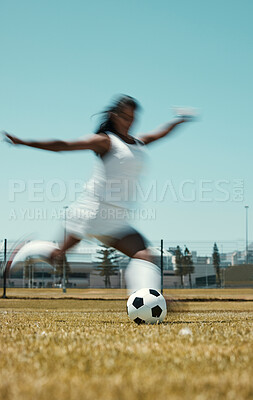 Motion blur soccer woman kick ball on stadium field, grass and sports competition game to score goals, winning and fitness. Female football athlete action, energy and dynamic shot in outdoor training