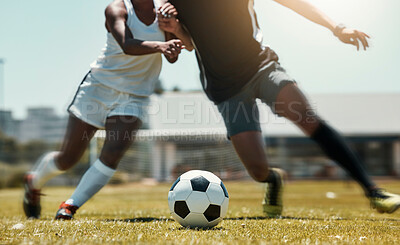 Football, sports and team legs in game on a field while passing, touching and running with a ball. Active, fast and skilled soccer players in a competitive game with workout on a sport pitch outdoors