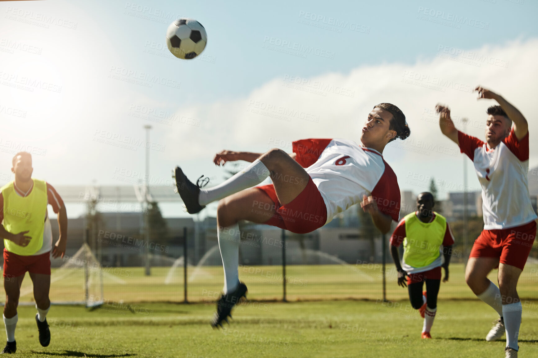 Buy stock photo Soccer team, man and ball kick in air during football match, competition or training. Sports, fitness and soccer players on grass field together in practice game, exercise or workout outdoor on pitch