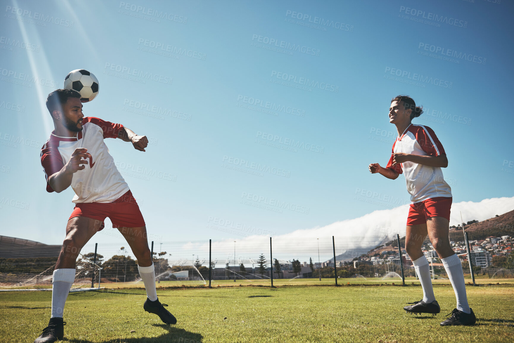 Buy stock photo Sports, summer and soccer ball on head on field during game or training exercise. Health, fitness and ball header, teamwork at football competition and players on grass together for performance match