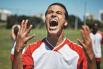Buy stock photo Win, celebration and soccer player victory scream at soccer field, celebrating success, goal and achievement. Happy, man and football winner express joy, cheering, and passion with athlete shouting