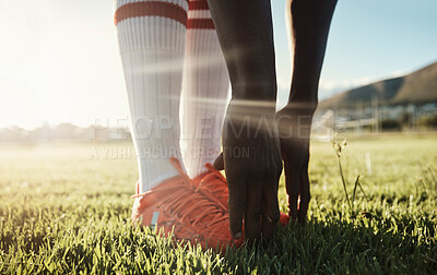 Buy stock photo Soccer player, stretching legs on grass and hands on shoes on pitch for sport fitness training start. Football, health and wellness workout for exercise warm up before Brazil summer game competition 