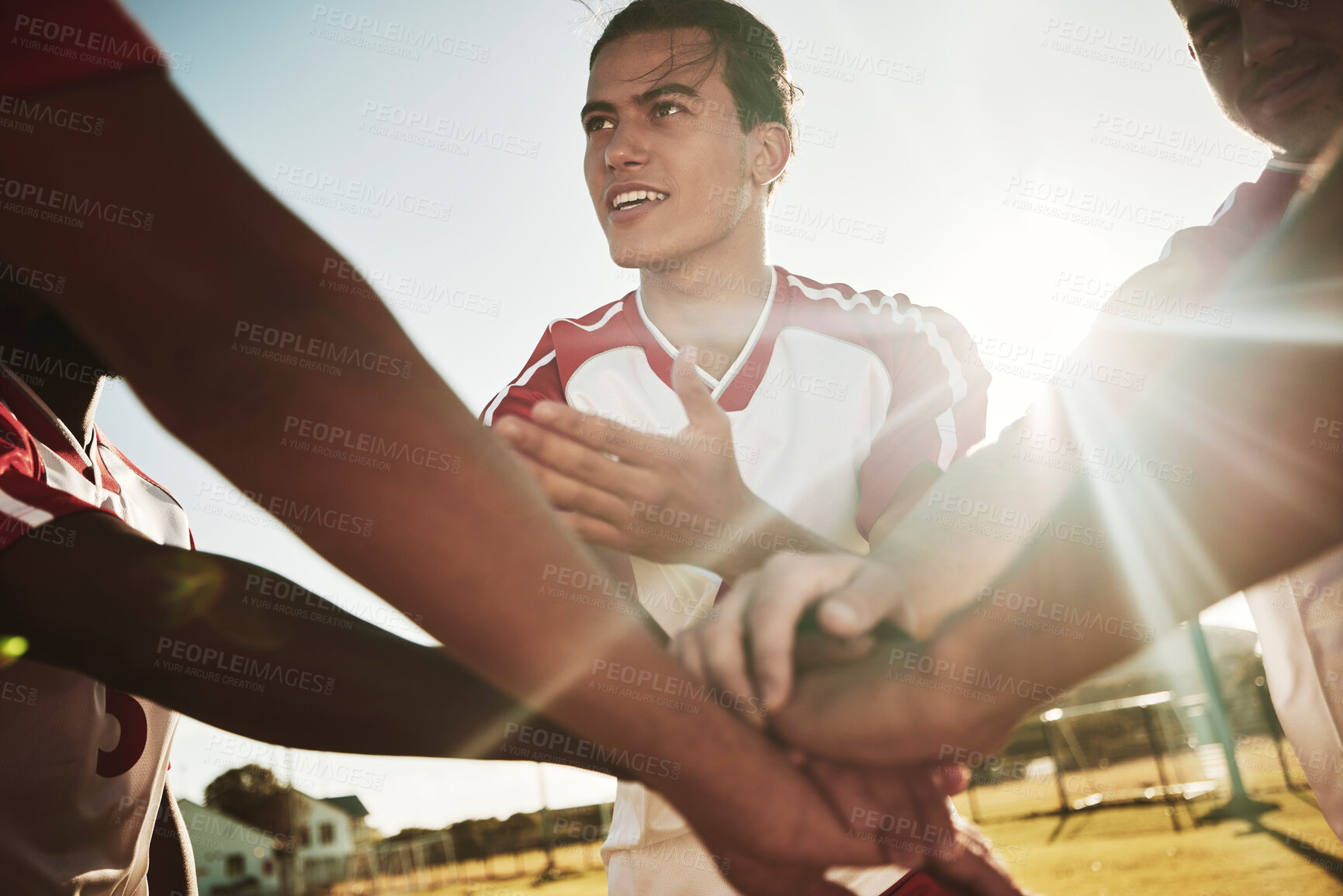 Buy stock photo Hands stacked, soccer and team with support and motivation to win a game of sports on a field. Group of athlete men speaking during a football competition for success, achievement and solidarity