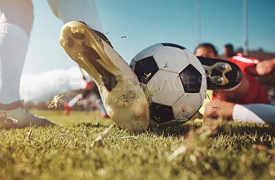 Soccer, soccer ball and man slide tackle during match, training or competition outdoors. Football, sports and football players on grass field for workout, fitness or exercise game on football pitch.