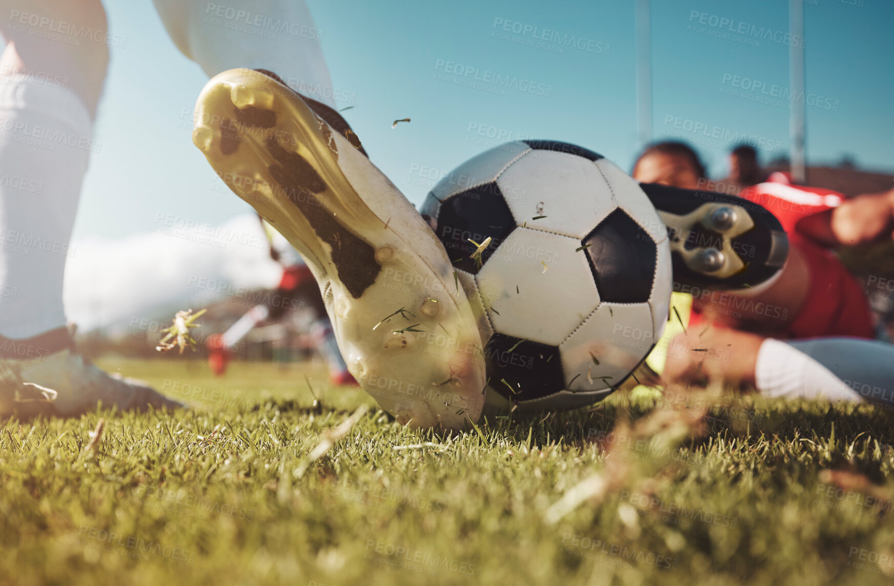 Buy stock photo Soccer, soccer ball and man slide tackle during match, training or competition outdoors. Football, sports and football players on grass field for workout, fitness or exercise game on football pitch.