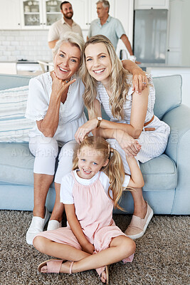 Buy stock photo Mother, daughter and child with smile for photo in the living room of their house together. Portrait of a happy, relax and calm child with her grandmother and mom during a visit in the lounge