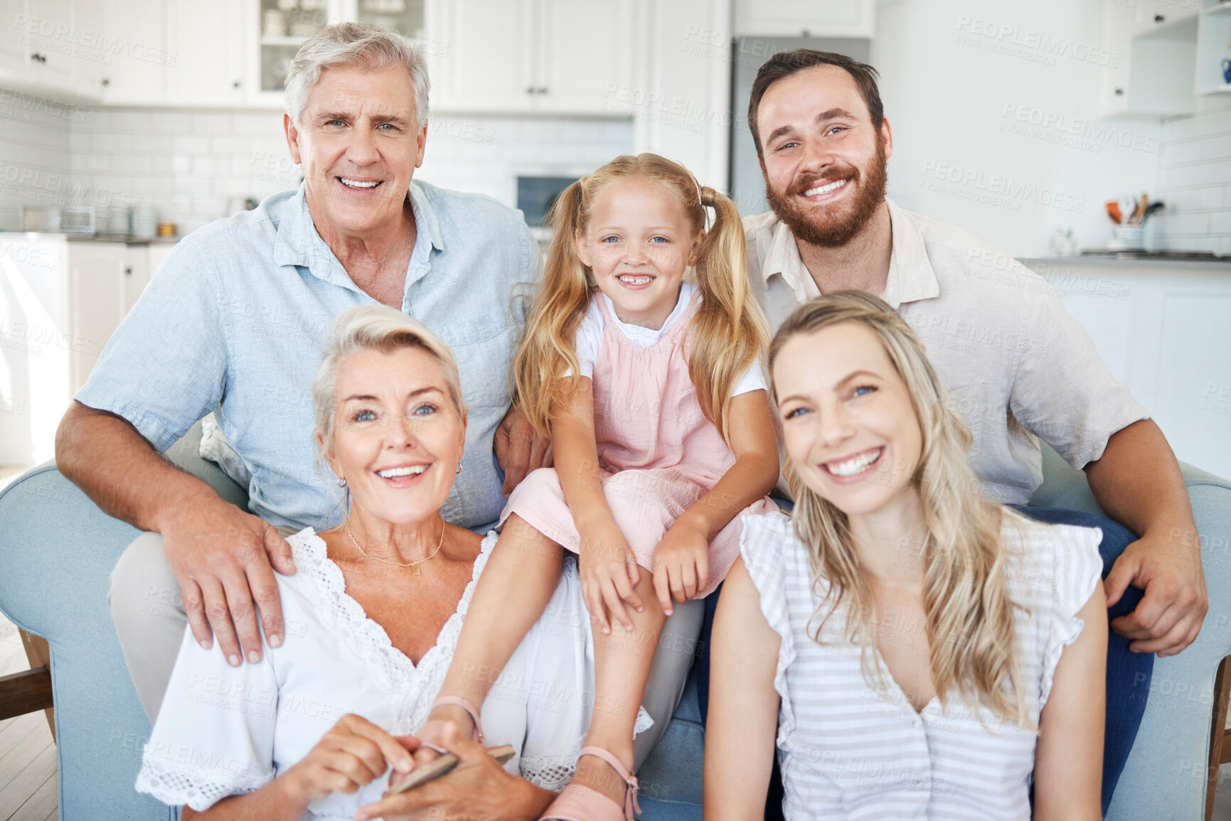 Buy stock photo Family, happy and together, love and bonding in portrait in the family home. Grandparent, parent and young girl, generation and spending quality time, happiness and smile on sofa in living room.