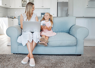 Buy stock photo Mother, girl child and digital device happy, learn and smile for bonding, embrace and talking together in living room on couch. Laptop, smartphone and mama with daughter browse online and home school