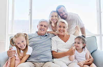 Buy stock photo Family, love and children with a girl, parents and grandparents sitting on a living room sofa at home together. Kids, happy or bonding with a senior man, woman and relatives on a couch during a visit