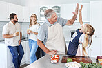 High five, happy family and cooking together in kitchen bonding activity. Parents smile, senior man teach kid to make organic  healthy lunch and good job child development through learning at home

