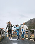 Happy, travel and family on outdoor walk while on a spring vacation, adventure or journey. Grandmother, mother and girl child walking on bridge together with happiness, fun and bond while on holiday.