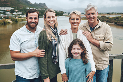 Buy stock photo Travel, portrait and happy family on holiday vacation outdoors to enjoy quality time together in Ireland. Grandparents, mother and father on a bridge with child bonding and relaxing on a weekend trip
