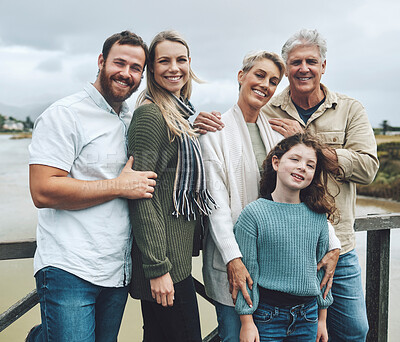 Buy stock photo Family, travel and vacation with a girl, parents and grandparents on holiday or a weekend getaway by a lake. Nature, children and portrait with a happy group of relatives outdoor on the water