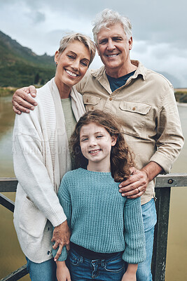 Buy stock photo Family, grandparents and child being happy, bonding and vacation with smile, holiday or together outdoor. Portrait, grandfather and grandmother with girl to relax, embrace and on road trip for travel