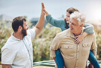 High five, grandfather and father with girl child walking in nature with piggyback ride. Happy, smile and family on outdoor walk together while on a summer vacation, adventure or holiday in Australia