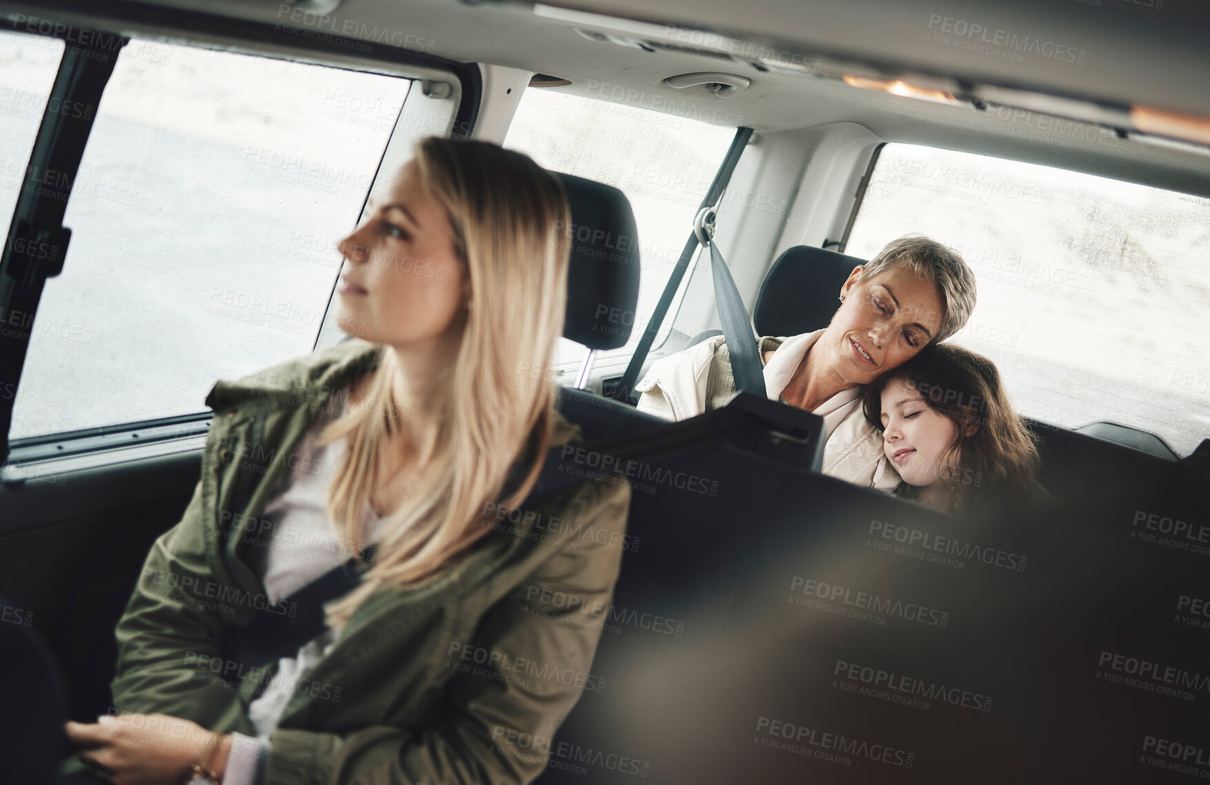 Buy stock photo Road trip, driving and family sleeping in the car tired from adventure, holiday and travelling on road. Travel, transport and girl asleep with grandmother in motor vehicle on drive home from vacation