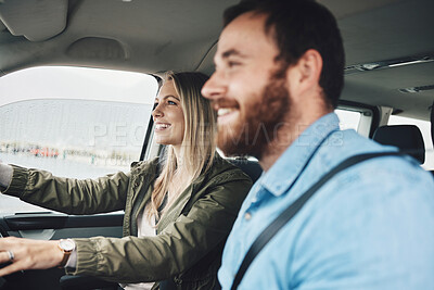Buy stock photo Couple in car, transport and travel on road trip together, happy on adventure and spending quality time. Young, man and woman drive, love and romance, smile while bonding on the road.