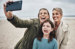 Beach, grandma and child selfie with phone for happy family holiday break together in Canada. Mother, daughter and grandmother capture joyful picture for social media on ocean leisure walk.

