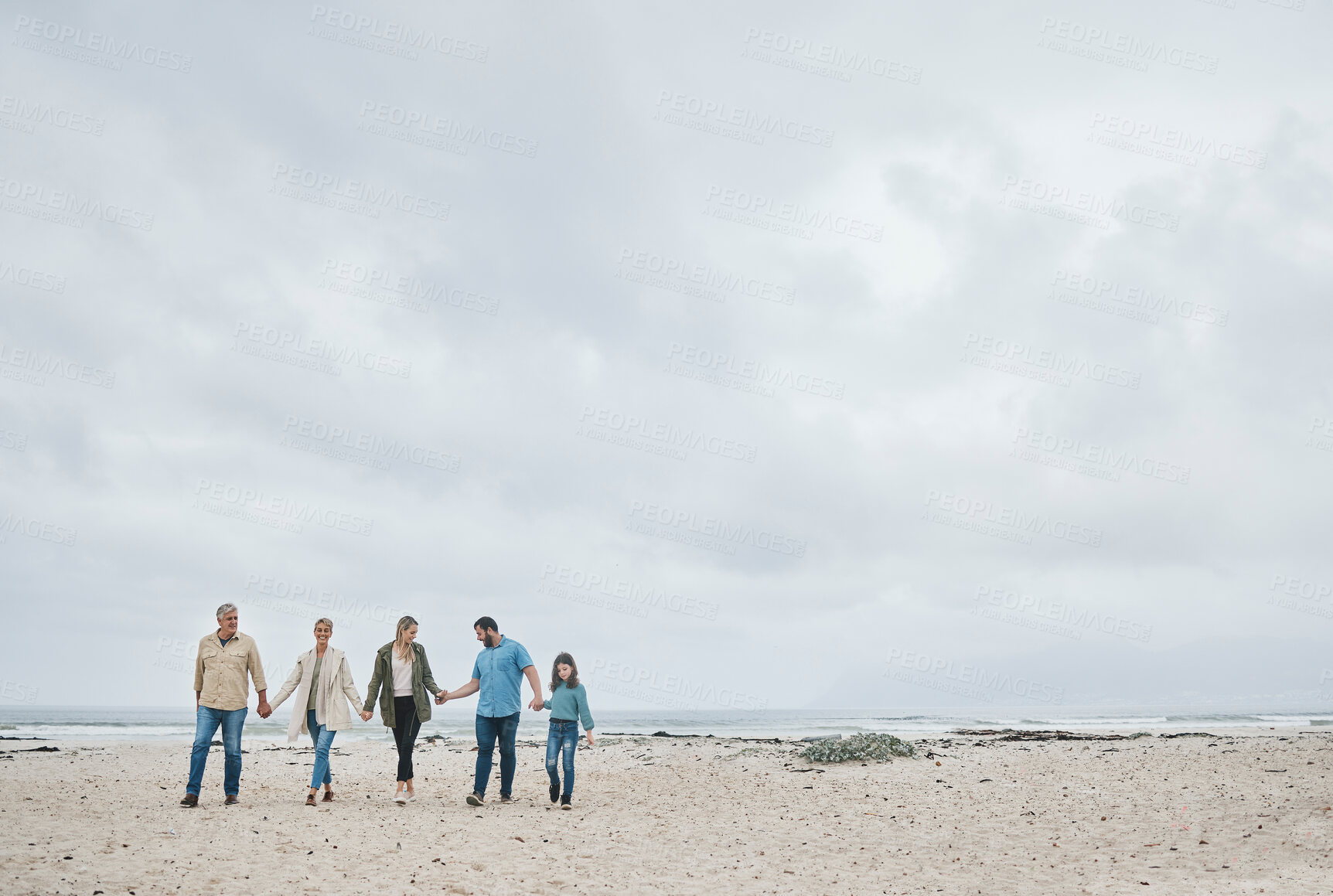 Buy stock photo Big family, beach holiday and travel with child, parents and grandparents. Men, women and girl together for love, freedom and care on sea trip to relax, bond and enjoy a tropical winter vacation