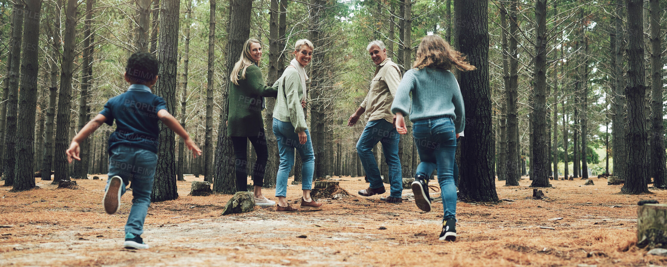 Buy stock photo Forest, big family and adventure with children, parents and grandparents walking in nature for outdoor hiking, fun and trees on wellness vacation. Running kids, travel and happy man and women in woods