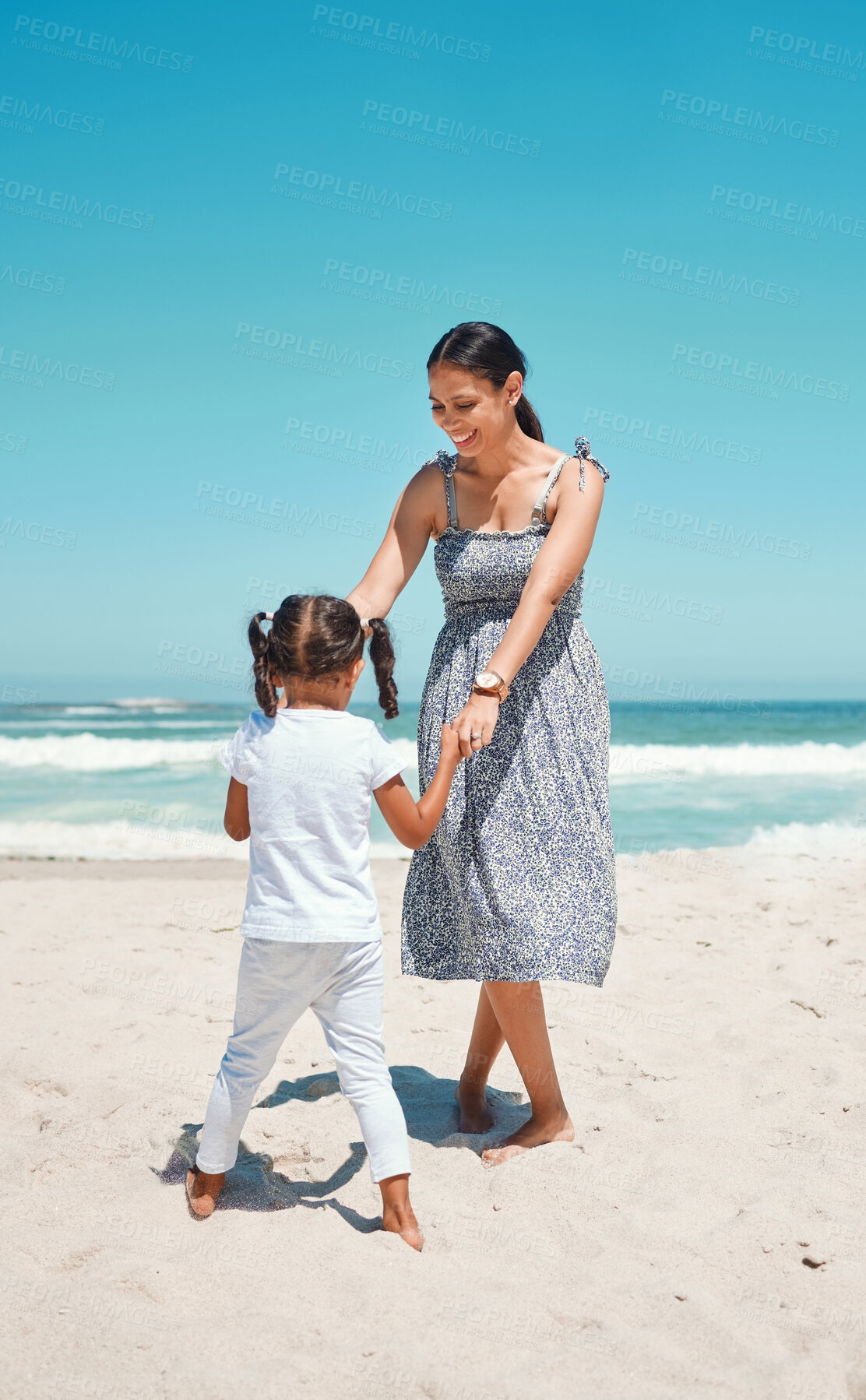 Buy stock photo Mother, girl and beach for dancing on sand in summer for play, comedy and bonding on vacation, holiday or trip. Mom, child and ocean for love, happiness and smile by sea in sunshine together in dance