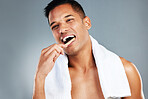 Man, toothbrush and teeth for dental hygiene in clean, fresh and wash for healthcare against a grey studio background. Portrait of a toothy male brushing mouth for oral and gum care treatment