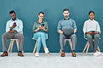 Business people, hiring and tech with some on mobile, laptop or tablet. Group of corporate workers, group or employee team on technology, computer or phone sitting and waiting for a job interview