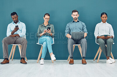 Buy stock photo Business people, hiring and tech with some on mobile, laptop or tablet. Group of corporate workers, group or employee team on technology, computer or phone sitting and waiting for a job interview