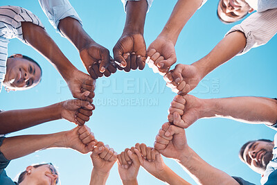 Buy stock photo Fist bump, teamwork and business people in a team building meeting for collaboration, motivation and support. Global, below view and workers hands in a huddle startup for goals, targets and mission