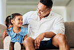 Father, girl and happy living room quality time at a family home with love and care on a sofa. Dad and young child smile on a couch with happiness relax smiling in a house lounge bonding together