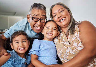 Buy stock photo Black family, grandparents and portrait with children while happy, love and bonding in home together. Elderly, man and woman with kids, girl and happiness for smile, care and vacation in living room