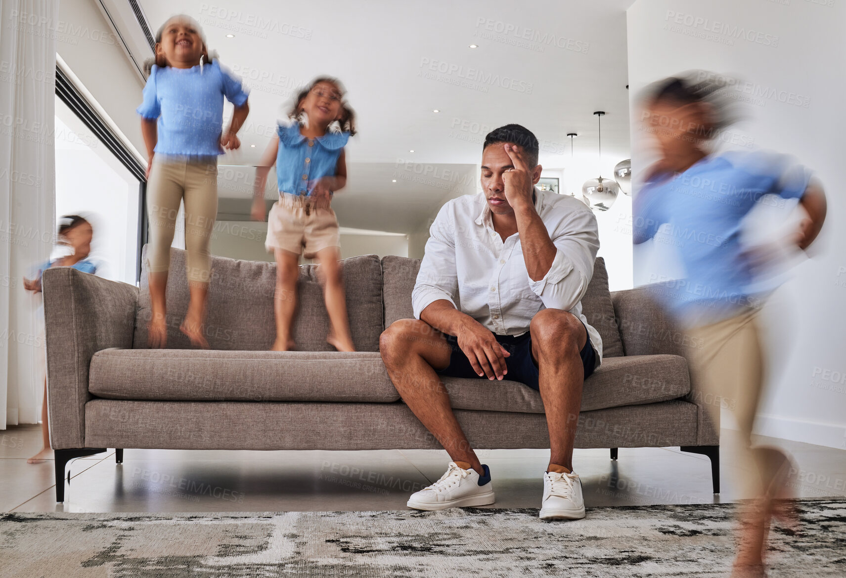 Buy stock photo Stress, headache and father with adhd kids running, jumping and playing in family home or house living room. Mental health, burnout or anxiety for parent with autism, energy and hyper active children