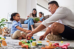 Learning, education and family play with blocks with father and creative daughter playing together in living room. Childhood, development or parent, mother or mom reading story book to girl on sofa

