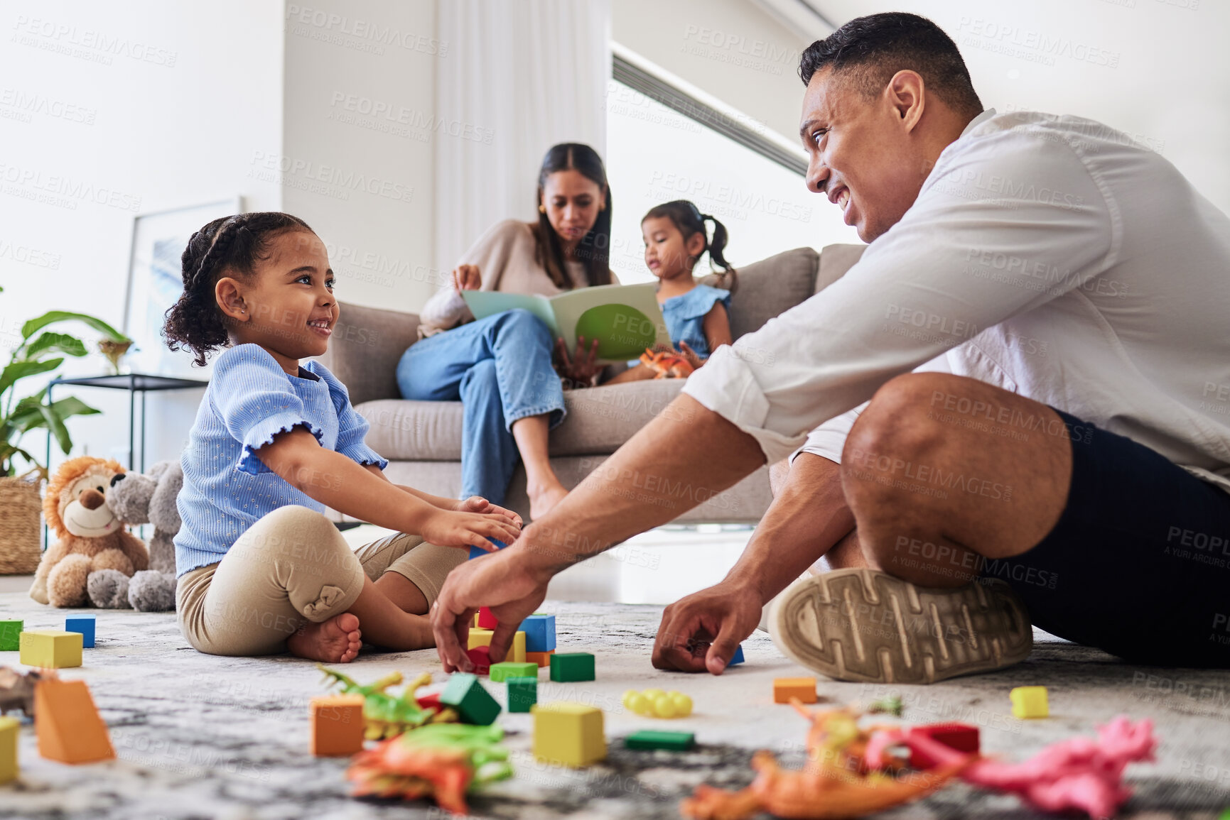 Buy stock photo Learning, education and family play with blocks with father and creative daughter playing together in living room. Childhood, development or parent, mother or mom reading story book to girl on sofa

