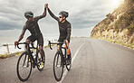 Bike, friends and men high five on road having fun cycling together outdoors. Success, diversity and teamwork of male cyclists on bicycles riding on street, exercise or workout training on asphalt.
