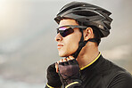 Cycling, helmet and sunglasses with a sports man being safe while outdoor for a ride on a cloudy day. Safety, cycle and fitness with a male athlete outside to exercise or workout for cardio health