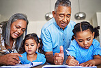 Homework, writing and grandparents helping children with education together at a table in their house. Girl kids learning in a notebook with a senior man and woman teaching, studying and giving help