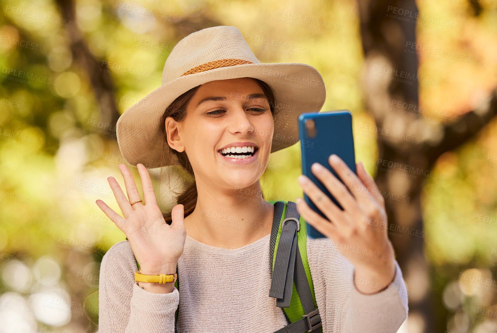 Buy stock photo Nature, hike and phone video call of a woman in nature talking and hiking outdoor. Happy smile of a person wave in a mobile conversation using 5g internet and technology on a tree forest walk 