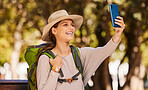 Phone, selfie and travel with a woman using 5g mobile technology to post a photograph to social media. Internet, backpack and communication with a female tourist using GPS navigation for directions