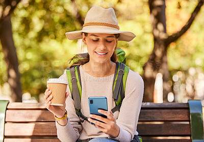 Buy stock photo Woman, phone and travel with coffee for backpacking in nature adventure relaxing on a park bench in the outdoors. Happy female traveler in social media, browsing or texting for trip on smartphone