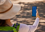 Summer, hiking and mockup of phone in hand of woman on adventure in city. Travel, explore and tourist using smartphone for directions, digital map or fitness tracking with blue screen for marketing