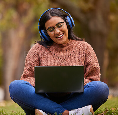 Buy stock photo Laptop, music and girl studying in a park, talking on a video call or learning on internet in Sweden. Happy, smile and relax student reading on pc for education and knowledge with podcast in nature