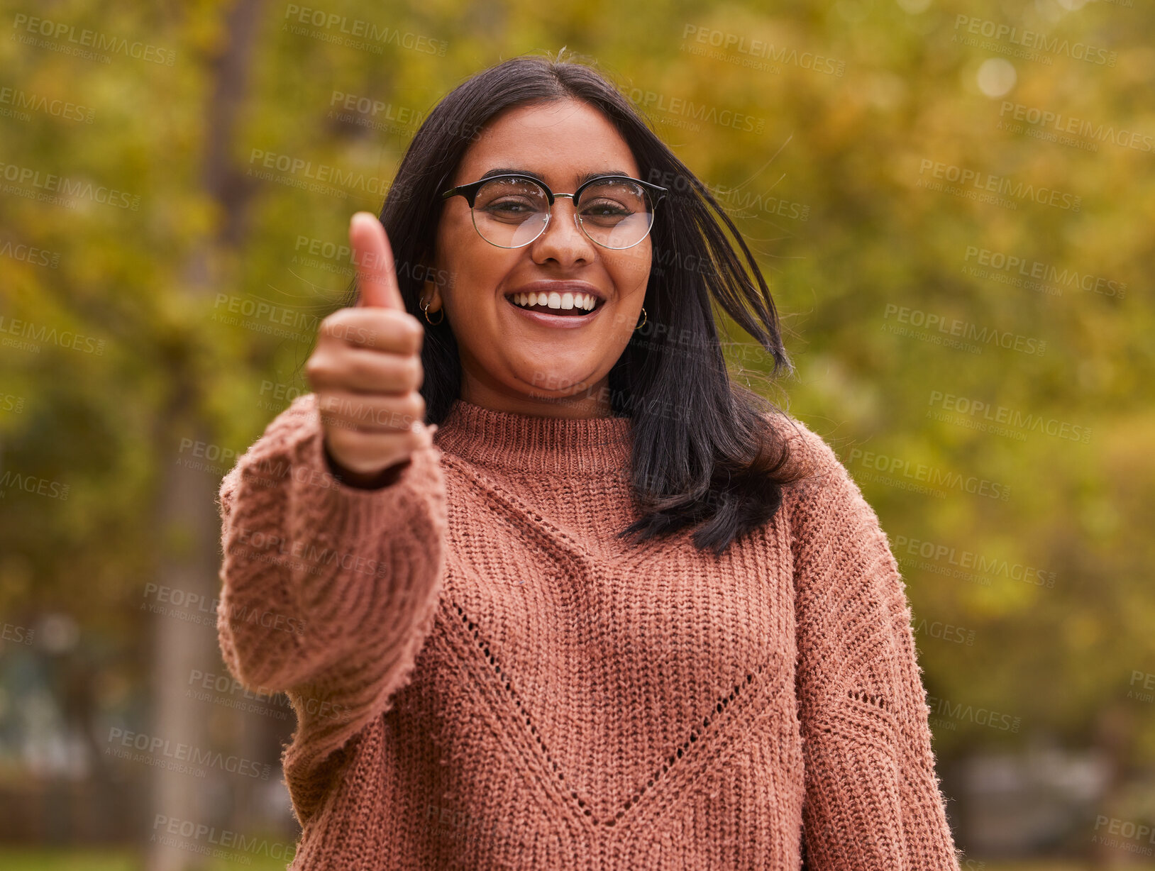 Buy stock photo Thumbs up, like and Indian woman in park for outdoor support, volunteer in eco environment or green success. Thank you, yes or ok agreement hand sign of a girl in portrait with countryside trees
