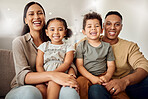 Family, mother and father with kids for love and smile relaxing on living room sofa for quality bonding time at home. Portrait of happy mama, dad and children smiling in happiness for break together