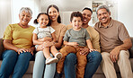 Relax, smile and big family on the sofa in the living room of their house for love, happiness and care. Portrait of happy and young kids with grandparents, mother and father on the sofa for bonding